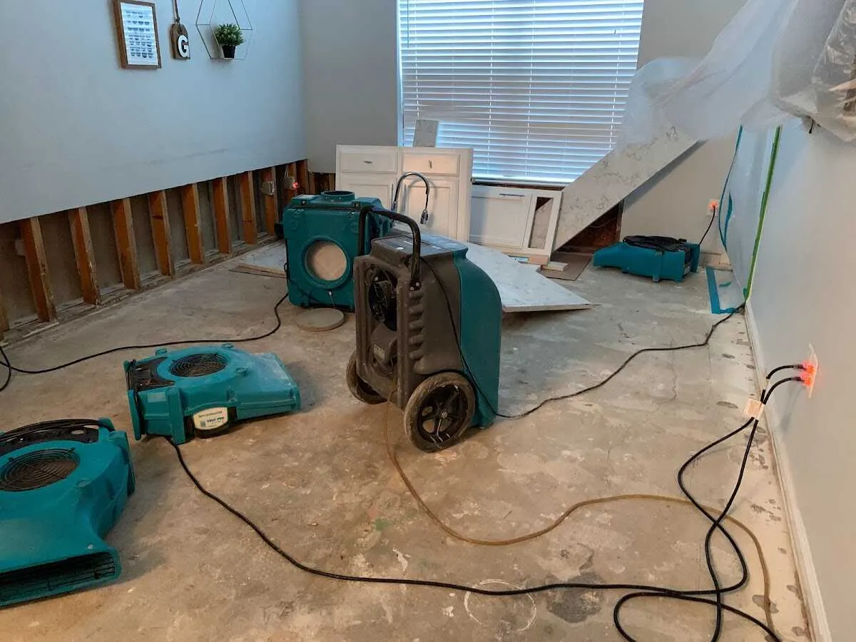 Dehumidifier in flood-cut room for Water Damage Restoration in Spring Arbor